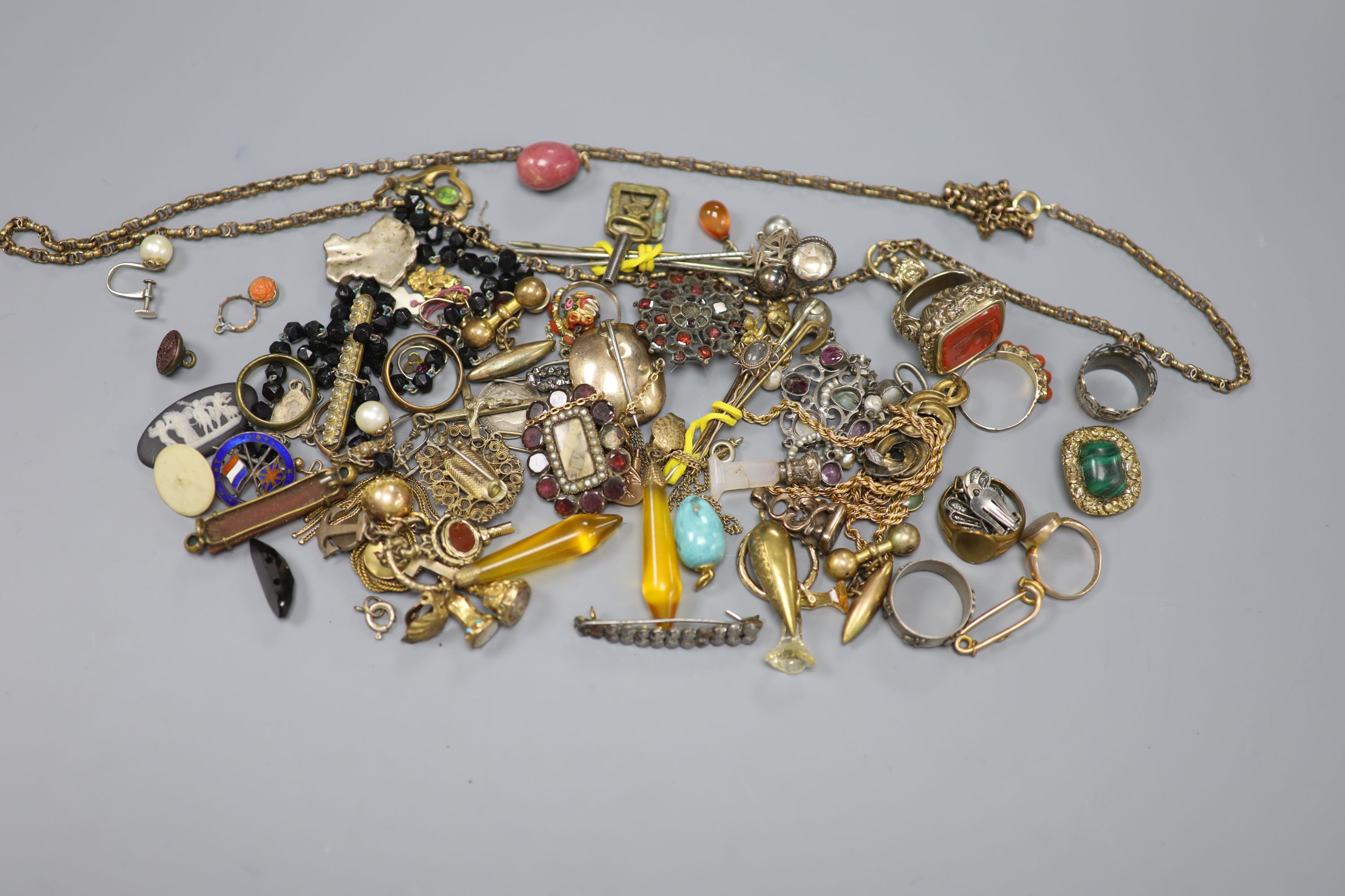 A quantity of assorted mainly 19th century jewellery including mourning brooches, fob seal, stick pins, etc.